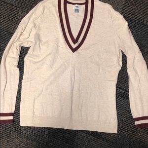 Cream colored long sleeve sweater with maroon